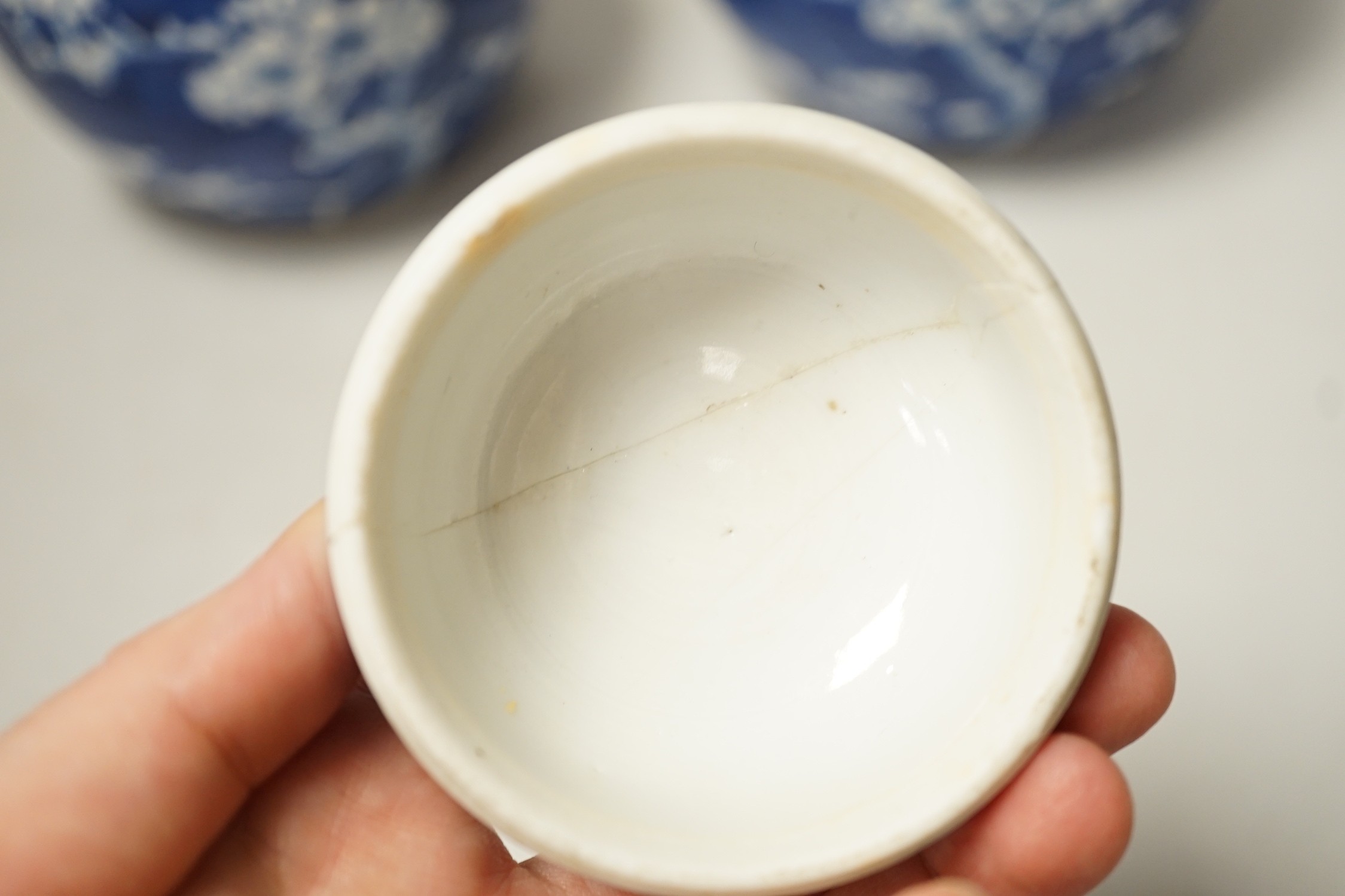 A pair of Chinese Blue and white prunus ginger jars. 15cm tall